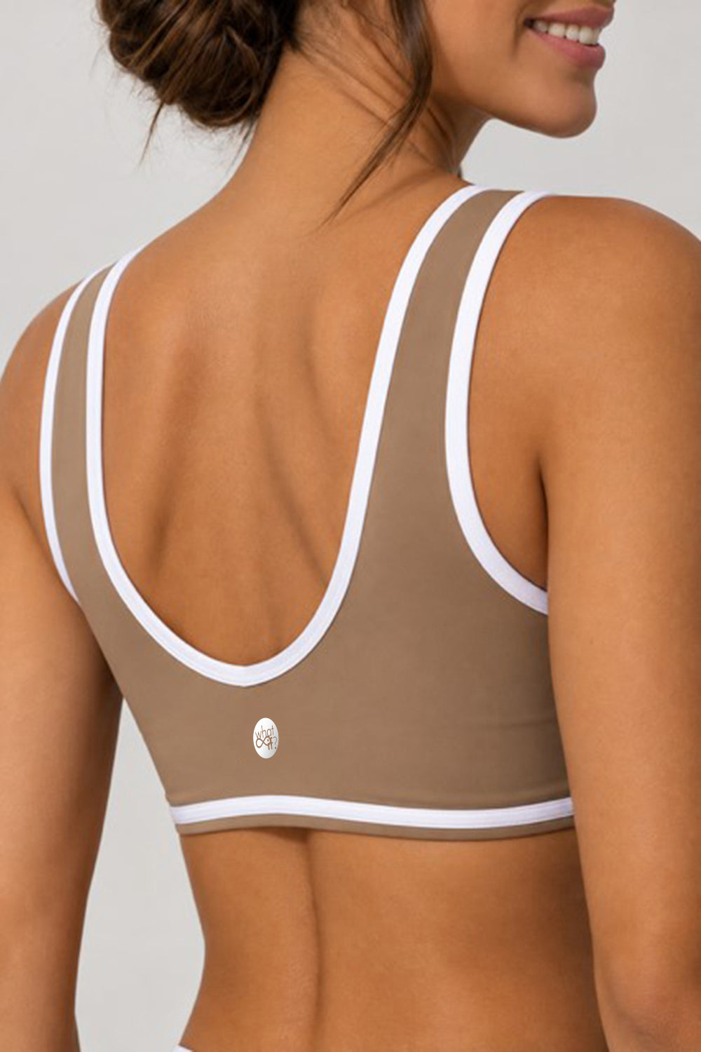 Sand sports bra with white trim, back close-up